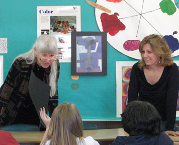 Photo of Judi and Tracy conducting art conferences