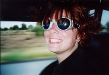 Reviewer riding in a dune buggy wearing goggles