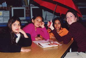 This is a photograph of Stephanie reading to students during Love of Reading.
