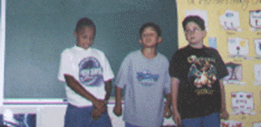 The photograph shows the students performing the skit.