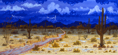 The lightning flashes above the mountains and the rain pours down from the deep blue clouds filling the wash and making small streams and puddles.